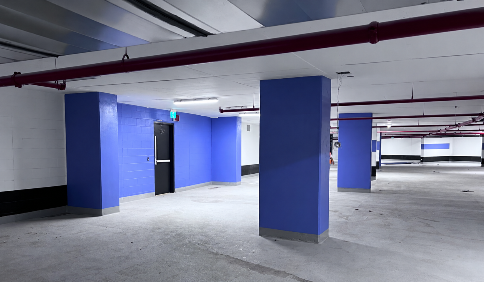 Underground parking garage with blue painted columns